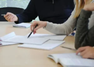 blc spain master's students studying together, reviewing notes and homework