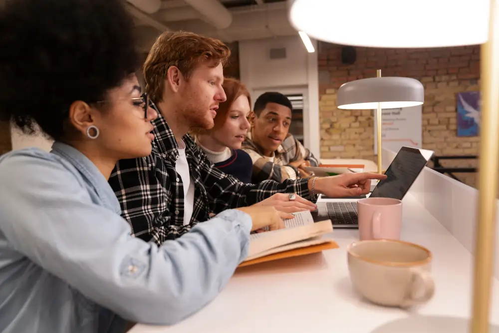 Collaborative group of international students at BLC Spain engaged in a discussion-based learning module.